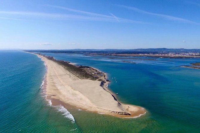 2 Stop | 2 Islands & Ria Formosa Natural Park - From Faro - Farol Island: lighthouse views and a livelier stop