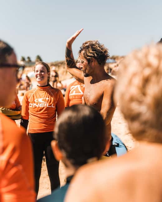 Albufeira: Beginner Surf Lesson - Meeting at the yellow-logo shop