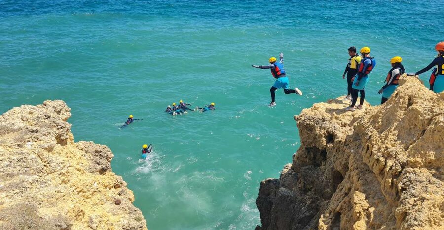 Albufeira: Guided Coasteering Tour with Cliff Jumping - Walking, scrambling, and swimming through the caves