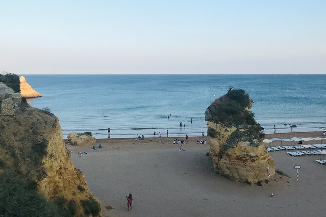 Algarve: Lagos sightseeing guided tour with E-bikes - Praia do Camilo delivers an early coastal reward