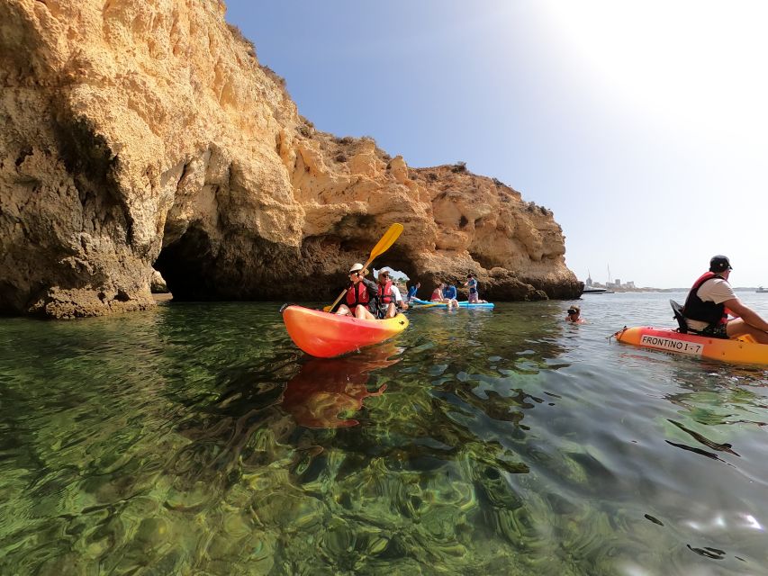 Alvor: Explore Caves Boat and Kayak Tour - The return cruise, local stories, and onboard bar
