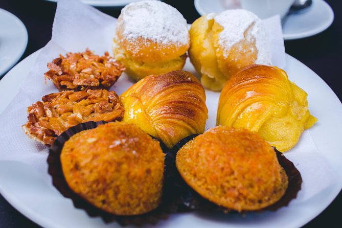 Authentic Food and Wine Tour in Porto by Food Lover Tour - The savory highlights, from pork sandwich to canned fish