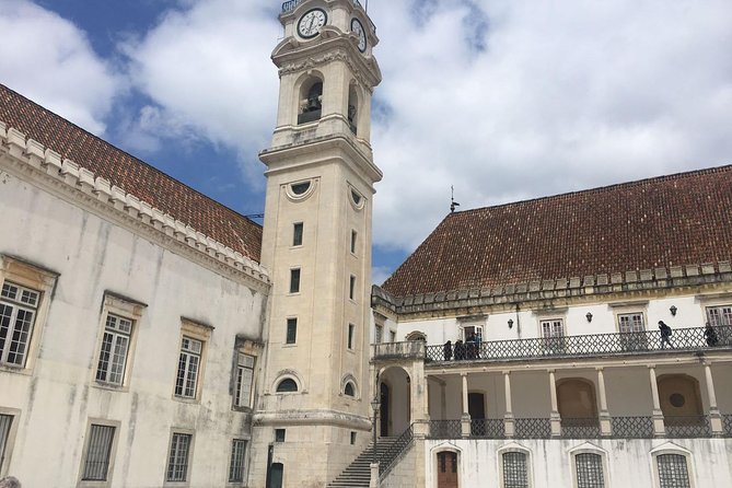 Aveiro and Coimbra Small Group Tour with Moliceiro Boat Cruise - Costa Nova’s colorful coastal stop