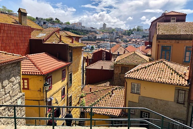 City Walking Tour & Port Wine Cellar - Crossing beneath the bridge to Vila Nova de Gaia
