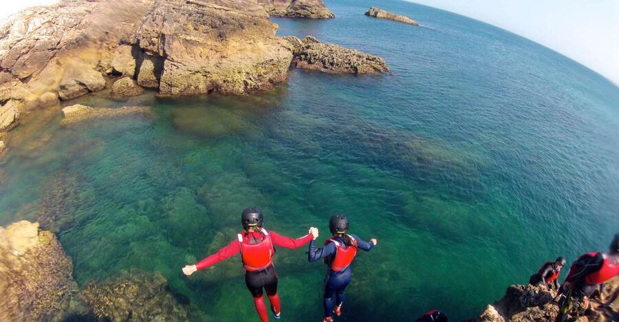 Coasteering Algarve: Cliff Jump, Swim & Climb in Sagres - Swimming through clear water and sea caves