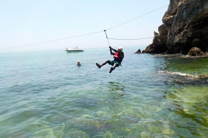 Coasteering at Portinho da Arrábida - Rappelling, rock climbing, and the final zip line