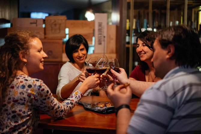 Drinks & Bites in Lisbon Private Tour - Wine, spirits, and the chocolate Ginjinha cup