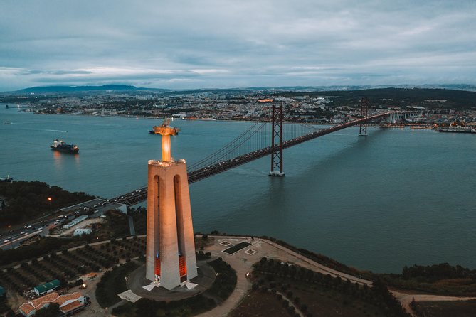 Explore Lisbon City on a private half-day tour in a van - Crossing the April 25 Bridge to Christ the King
