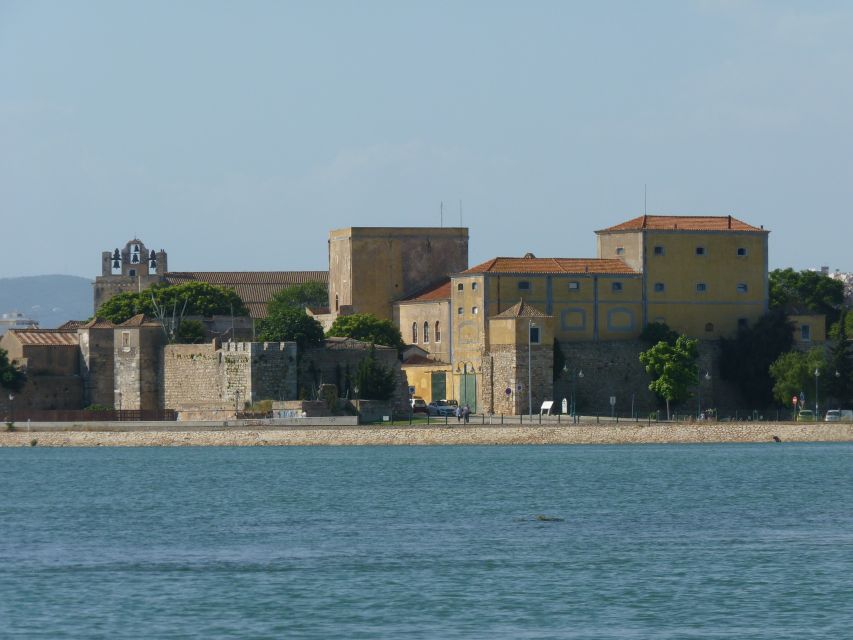 From Faro: 4 Stops, 3 Islands in Ria Formosa Catamaran Tour - Farol: lighthouse, houses, and a livelier island mood