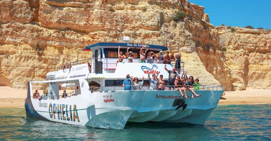 From Portimão: Catamaran Cruise to Benagil Caves with BBQ - Beach time, umbrellas, and a cooked lunch