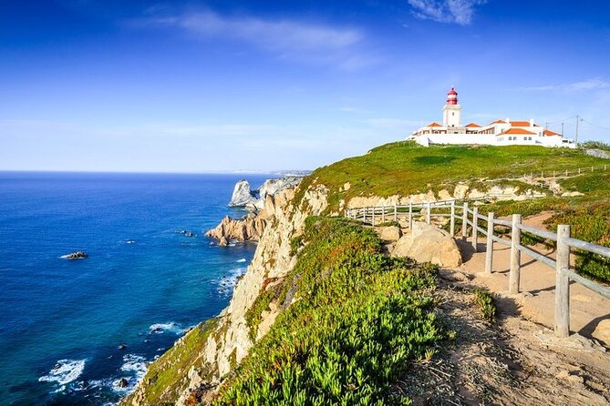 Full Day Tour: Sintra, Pena Palace, Cabo da Roca, Cascais - Standing at Cabo da Roca