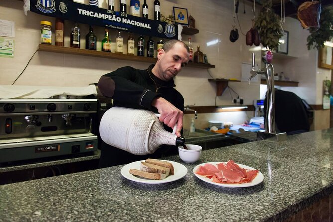 Half-Day Walking Tour Tasting Local Food in Porto - São Bento Station and its blue tile panels