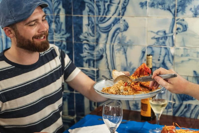 Lisbon: Baixa Food Walking Tour with Drinks - A glimpse toward Alfama