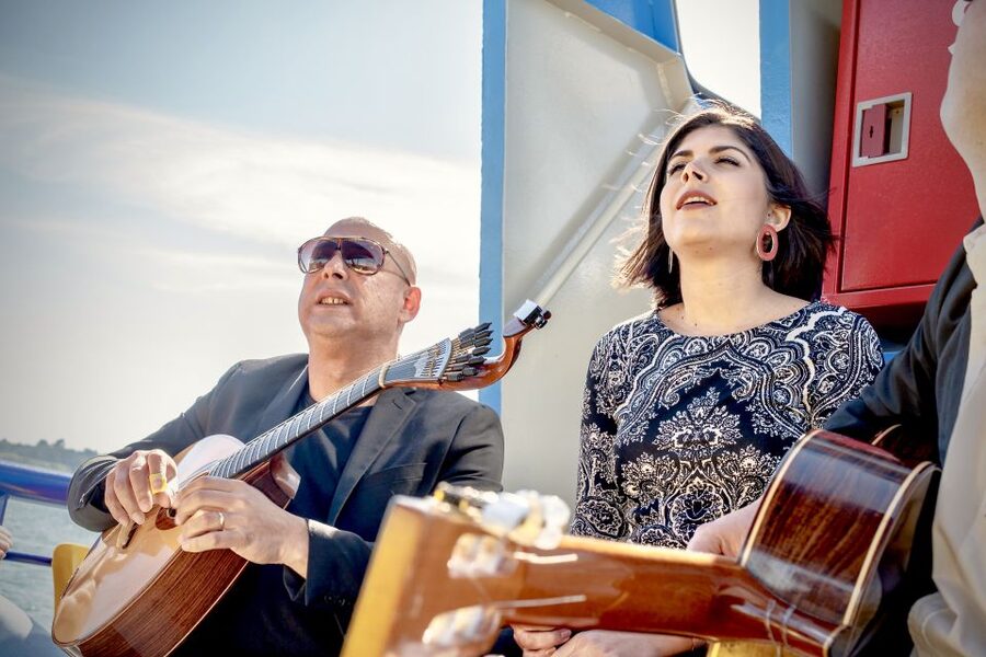 Lisbon: Boat Cruise with Live Fado Performance and a Drink - Passing Commerce Square and the central waterfront