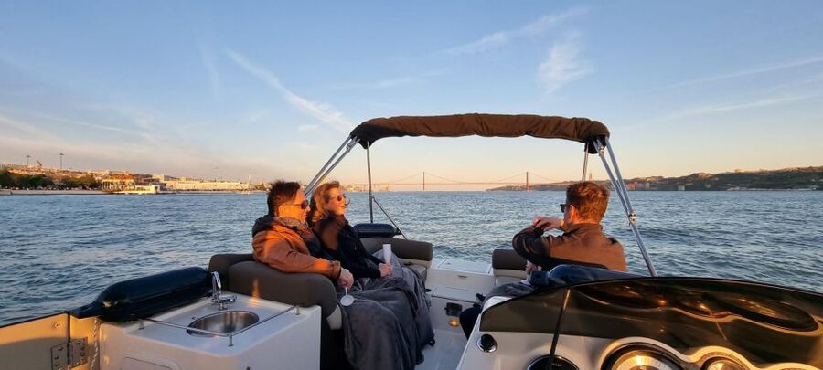 Lisbon: Boat Tour with Champagne - Under the 25 de Abril Bridge toward Christ the King