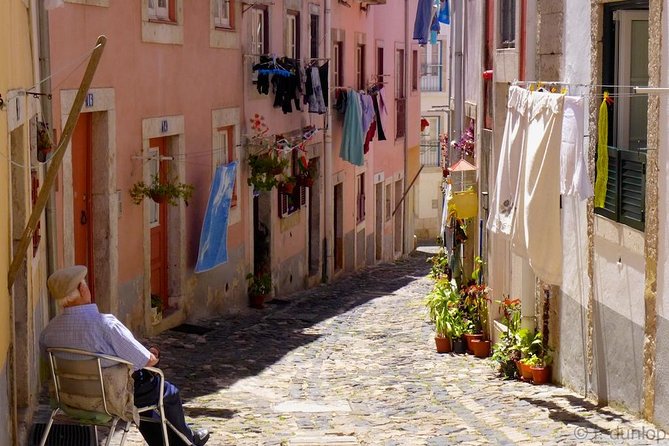 Lisbon by Night Tour: Fado Show and Dinner with Pick-up - Alfama provides the main show and dinner
