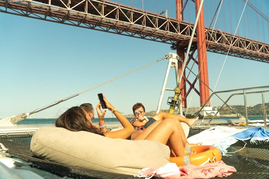 Lisbon: Catamaran Boat Party with Music, Open Bar & Dives - Setting out from Doca de Santo Amaro