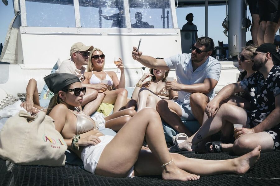 Lisbon: Catamaran Boat Party with Music, Open Bar & Dives - Weather, cancellation, and useful planning details