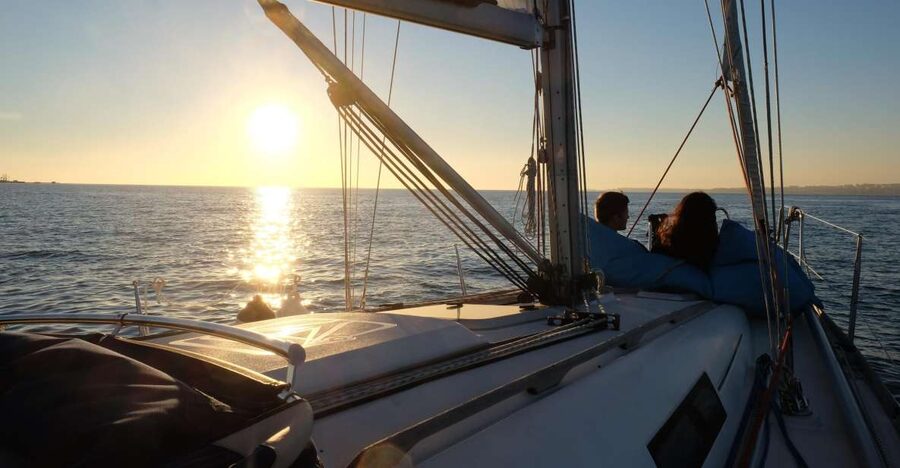 Lisbon: City Skyline Sailboat Cruise with Drink and Snacks - Wine, snacks, and the social side of the cruise