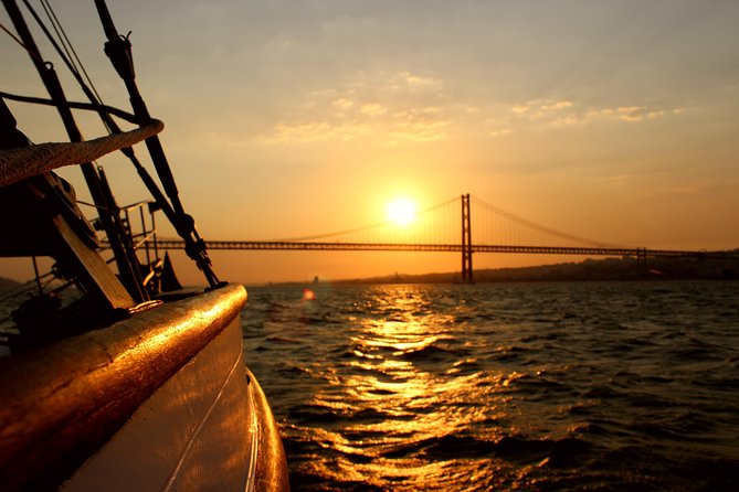 Lisbon: Daylight or Sunset on a Vintage Sailboat - Setting sail beneath the 25 de Abril Bridge