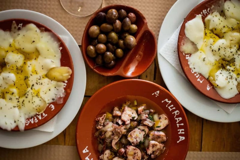 Lisbon: Food Tasting Tour by Tuk Tuk with 2 Stops - Alfama: food, wine, music, and crooked lanes