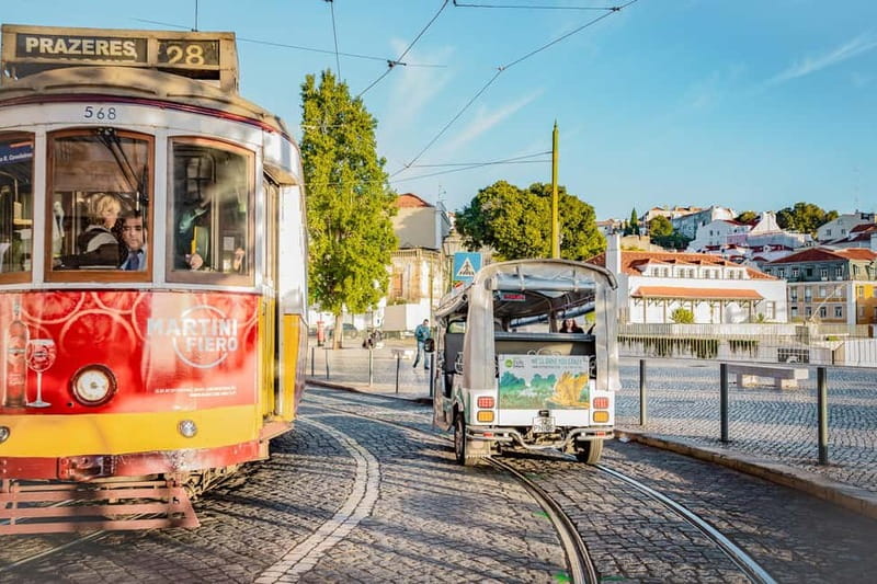 Lisbon: Half-Day Private Tuk Tuk Tour - Crossing the riverfront toward Belém