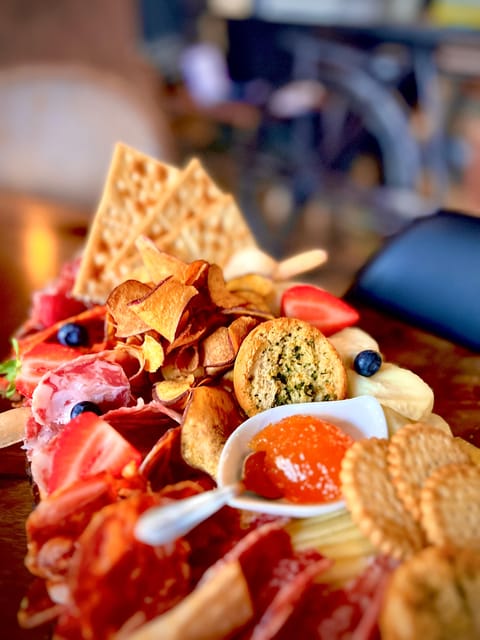Lisbon: Premium Wine and Tapas Tasting Session - A charcuterie board that can replace dinner