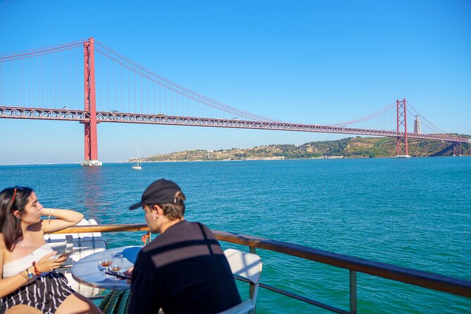 Lisbon River Boat Sightseeing Tour with a Drink - Crossing beneath the 25 de Abril Bridge
