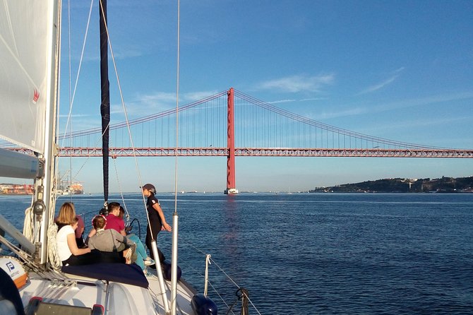 Lisbon Sailing Tour on a Luxury Sailing Yacht with 2 Drinks - Under the 25 de Abril Bridge toward Cristo Rei