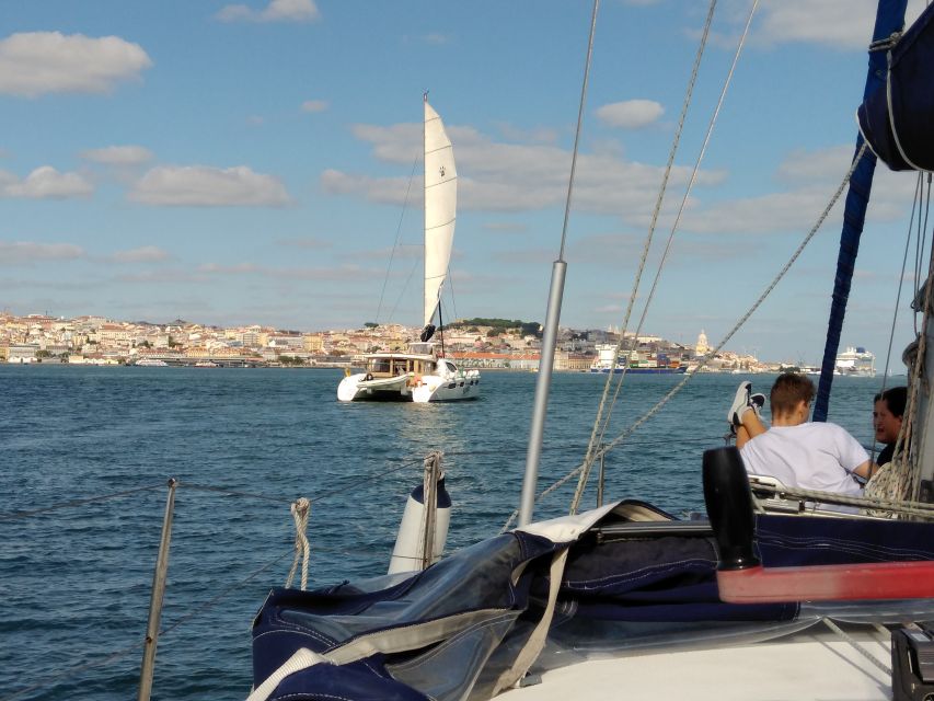 Lisbon: Sailing Tour with Wine and Snacks - Under the 25 de Abril Bridge