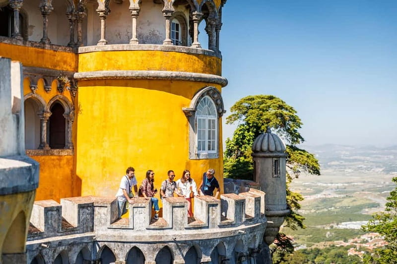 Lisbon: Sintra Cascais & Pena Palace Small Group Tour - Guincho Beach from the van window