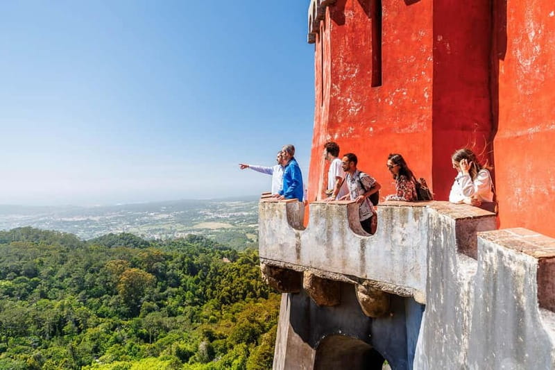 Lisbon: Sintra Cascais & Pena Palace Small Group Tour - Entering Pena Palace after a walk through the park