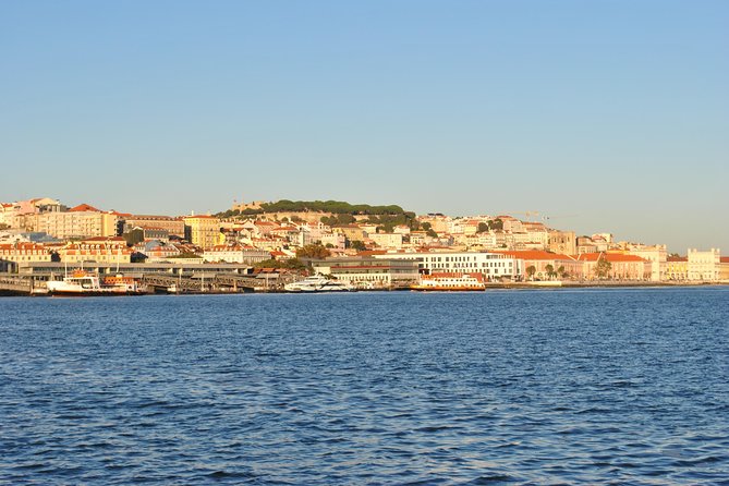 Lisbon Small Group Day Cruise with Historic Commentary & a Drink - The Discoveries Monument from the Tagus