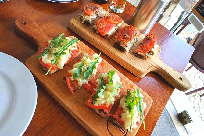 Lisbon Small-Group Food Tour with 18 Tastings in Alfama District - Eating your way through Alfama