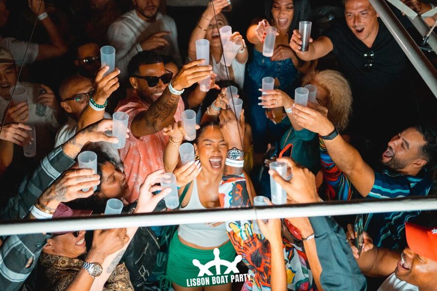 Lisbon: Sunset Boat Party with 2 Drinks and Free Club Entry - A sunset party with Lisbon as the backdrop