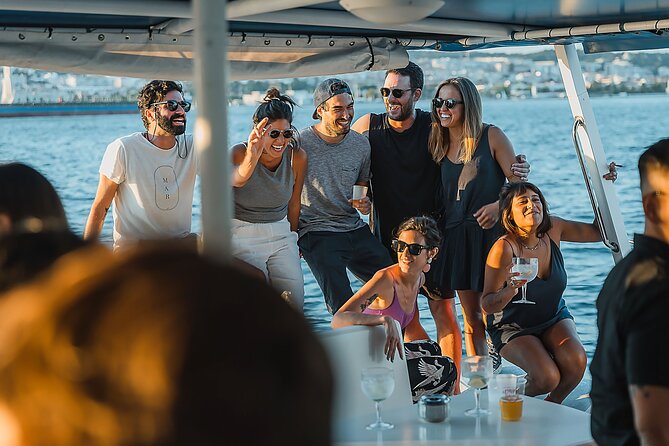 Lisbon: Sunset Catamaran Boat Tour with Music and Drinks - Christ the King and the 25th of April Bridge