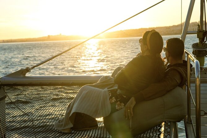 Lisbon: Sunset Catamaran Boat Tour with Music and Drinks - The Discoveries Monument and Jerónimos Monastery