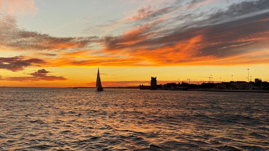 Lisbon: Sunset Cruise with Drinks and Snacks - The guides make the small boat work