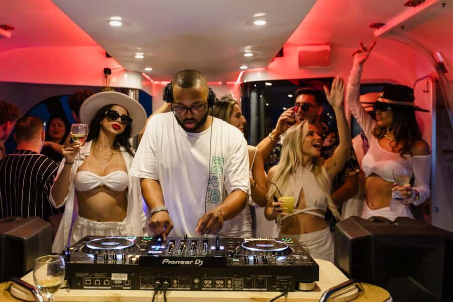 Lisbon: Sunset/Night Boat Party with Open Bar, Snacks & DJ - Returning past Commerce Square