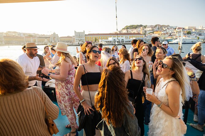 Lisbon: Sunset on board with music & drinks - Christ the King and the 25th of April Bridge