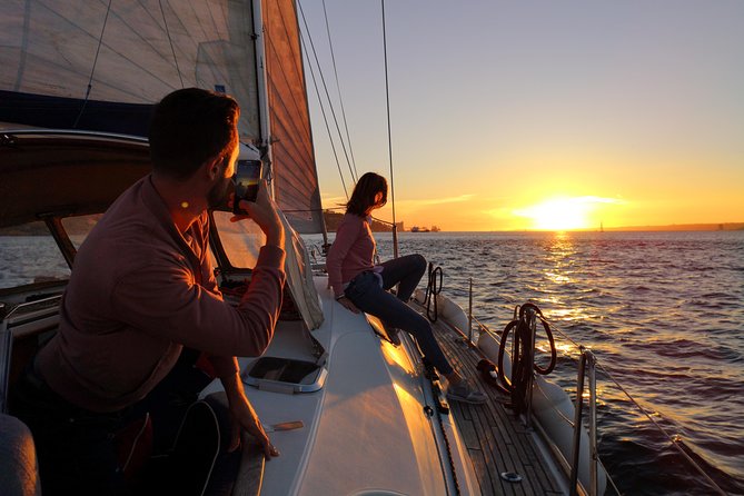 Lisbon Sunset Sailing Tour on Luxury Sailing Yacht with 2 Drinks - Under the 25th of April Bridge