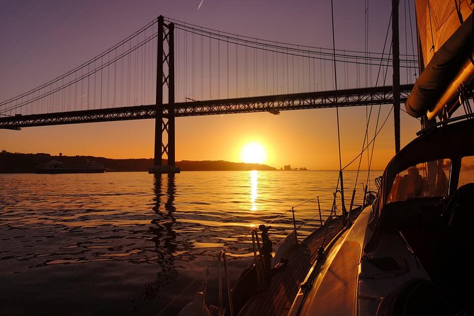 Lisbon Sunset Sailing Tour on Luxury Sailing Yacht with 2 Drinks - Wine, cheese, and the sunset hour