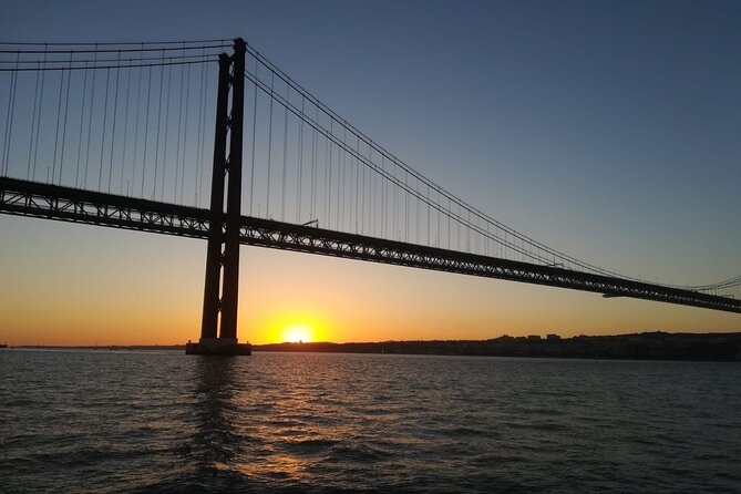 Lisbon Sunset Sailing with Portuguese Wine and History - Christ the King and the Almada shore