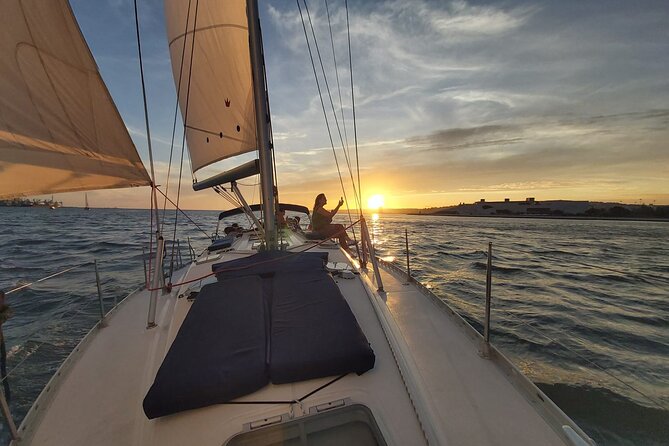 Lisbon Sunset Sailing with Portuguese Wine and History - Looking up toward the castle, Alfama, and the cathedral