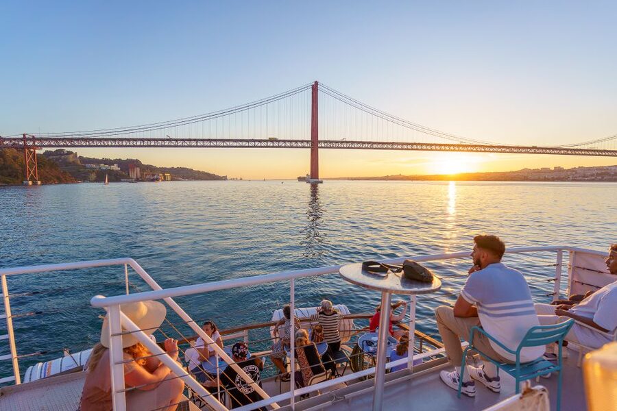 Lisbon: Tagus River Sunset Tour with Snacks and Drink - Christ the King across the Tagus