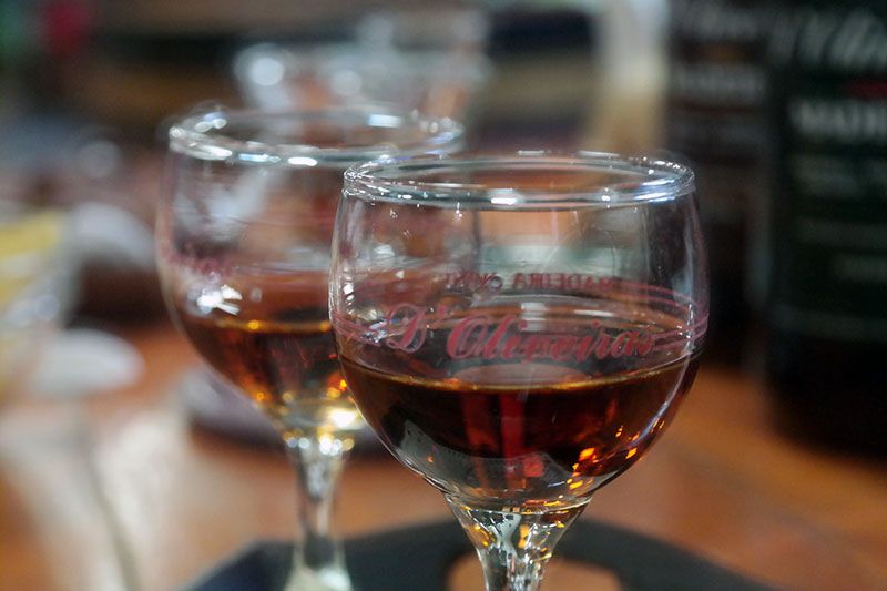 Madeira: Food and Wine Walking Tour in Funchal - Stop 2: Carne vinho e alhos, bolo do caco, and Coral beer