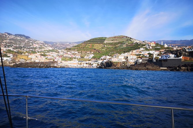 Madeira Private Sunset Boat Tour from Funchal - Funchal’s cliffs, hotels, and evening lights