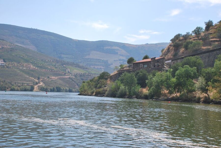 Pinhão: 2-Hour Rabelo Boat Tour with Audio Guide - Setting out beneath the iron bridge