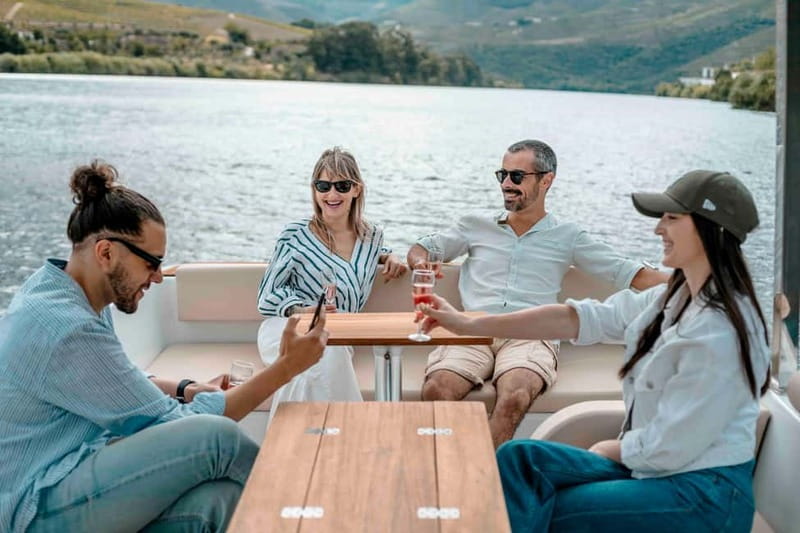 Pinhão: Douro River Solar Boat Tour with Wine Tasting - Two wines with a Douro view