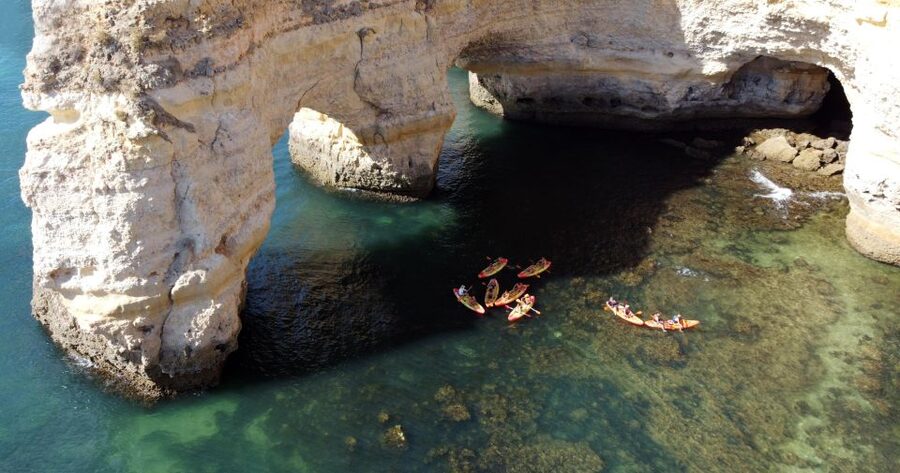 Portimão: Benagil Caves Speedboat and Kayak Guided Tour - Entering Benagil Cave by kayak